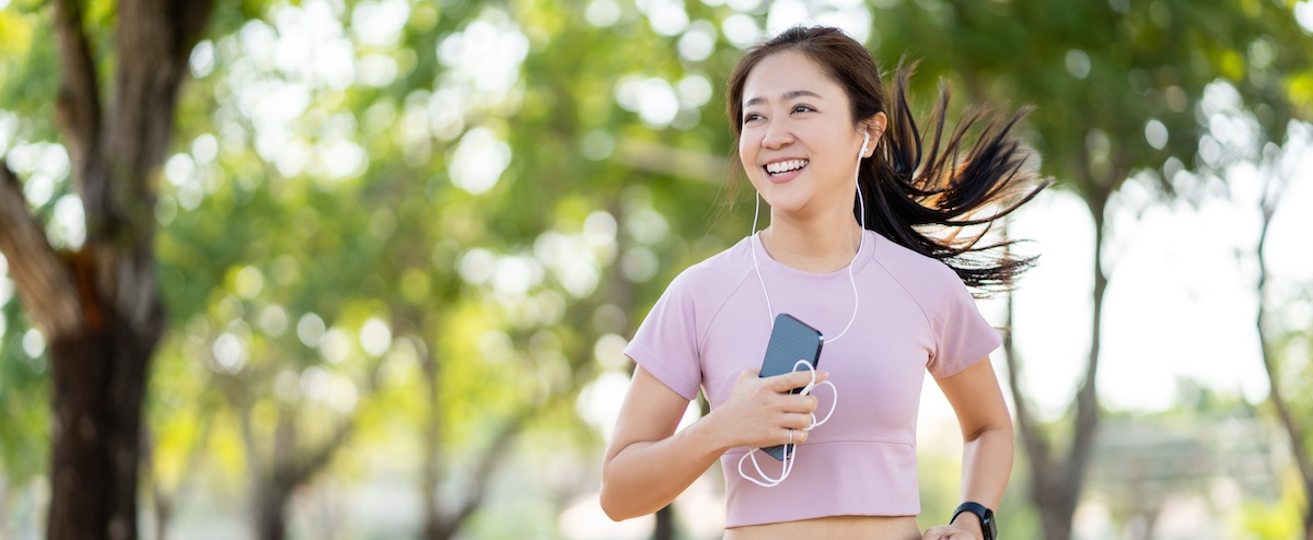 Healthy woman running in the park in the morning.